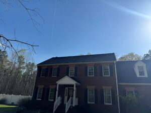 Dramatic roof transformation in Mechanicsville featuring Owens Corning Onyx Black architectural shingles.
