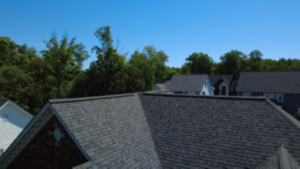 Close-up of Williamsburg Gray architectural shingles showing deep shadow lines and expert installation in Moseley