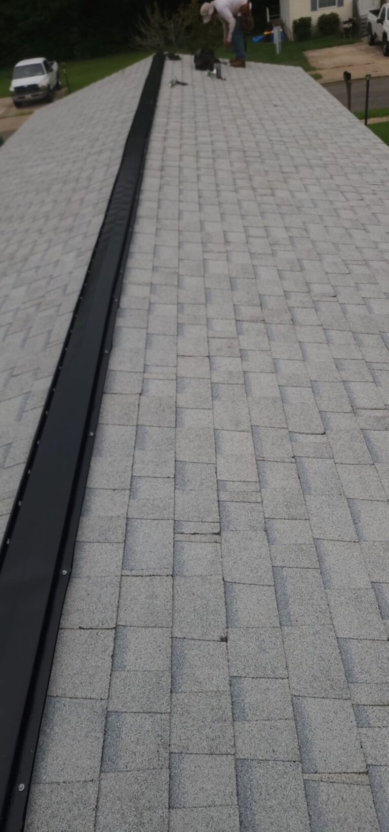 Close-up of a newly installed Owens Corning TruDefinition shingle roof in Shasta White on a single-story home in Montross, VA